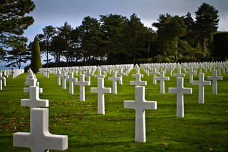 Frenchman tends ww2 Normandy Grave